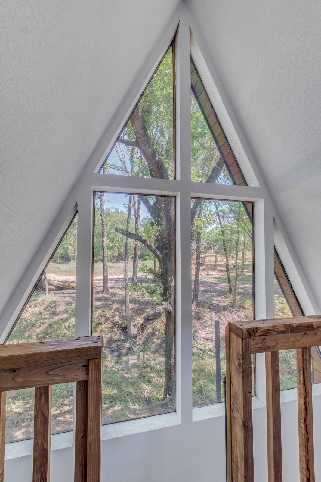 Loft and A-frame window in a Lake Noire cabin